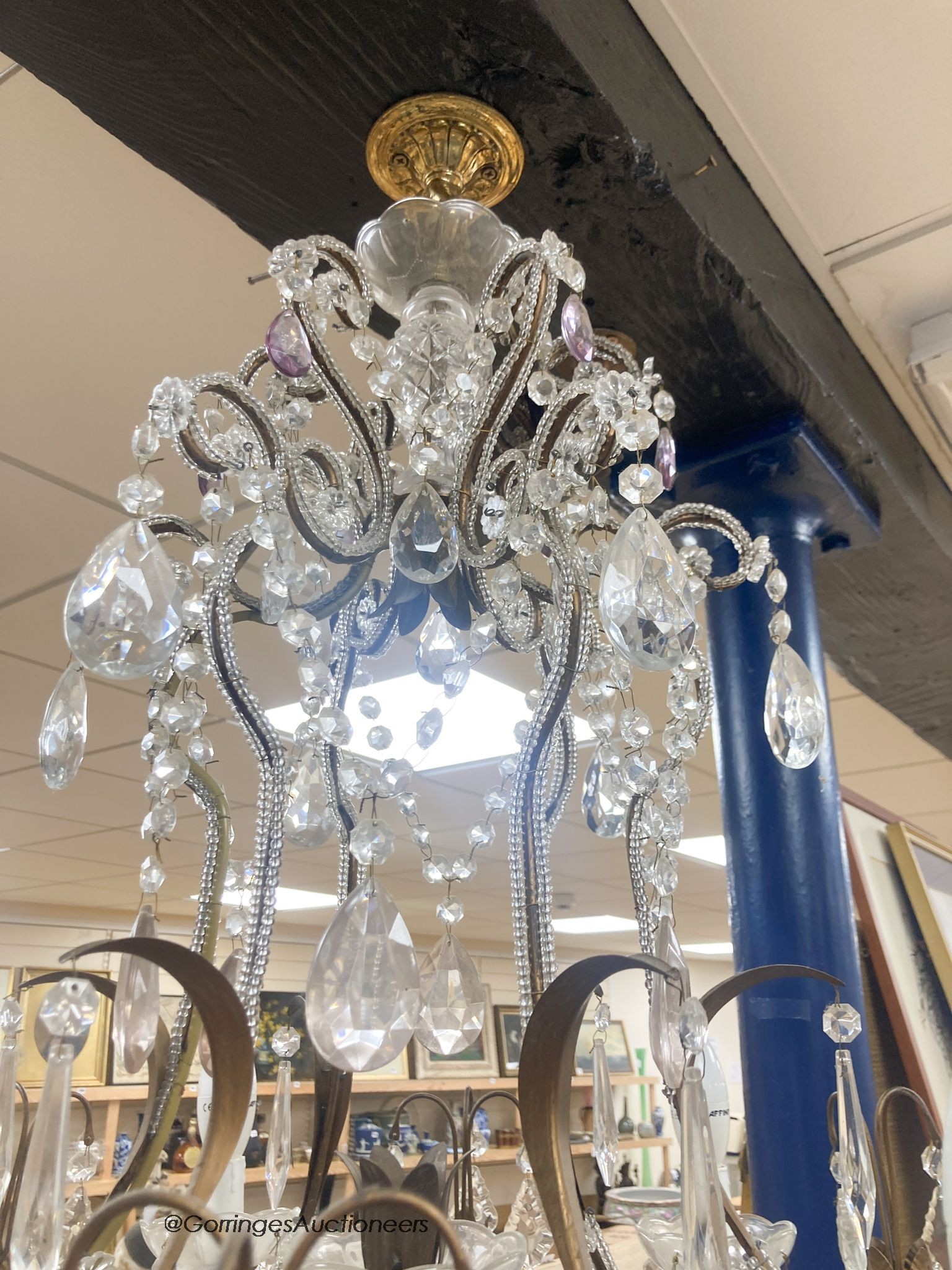 A gilt metal cut glass and lustre hung seven light chandelier 84cm high